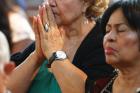 MAKING ALL WELCOME. A woman prays during a Spanish-language Mass at St. John-Visitation Church in the Bronx, N.Y., on Sept. 13. 