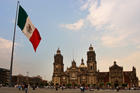 The Mexican Flag flies on the Zocalo near the Metropolitan Cathedral in Mexico City.