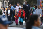 PROMISES TO KEEP. People stand at an intersection in Koreatown, one of several neighborhoods designated by the Obama administration as a promise zone in Los Angeles, Calif., Jan. 22, 2014.