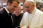 Pope Francis exchanges gifts with French President Emmanuel Macron during a private audience at the Vatican in June 2018. (CNS photo/ Alessandra Tarantino, pool via Reuters)