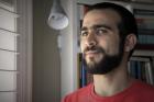 Former Guantanamo Bay prisoner Omar Khadr, 30, is seen at a home in Mississauga, Ont., on July 6. (Colin Perkel/The Canadian Press via AP)