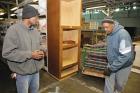 SUCCESS STORY. Michael Gordon, left, has become a manager for a furniture bank run by Caritas, an agency providing services to homeless people in Richmond, Va. (CNS photo/Jay Paul)