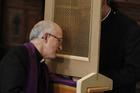 Priest of the Legionaries of Christ hears confession during ordination of 31 new Legionary priests. (CNS photo/Paul Haring)