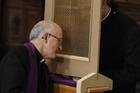 Priest of the Legionaries of Christ hears confession during ordination of 31 new Legionary priests. (CNS photo/Paul Haring)