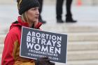 A young woman with Students for Life holds a sign outside the U.S. Supreme Court prior to the Women's March on Washington Jan. 21. (CNS photo/Bob Roller)