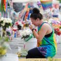 A woman cries while visiting the memorial outside the Pulse nightclub in Orlando, Fla., June 12, the one year anniversary of the mass shooting. The Diocese of Orlando broadcast via Facebook Live a prayer service attended by clergy of various faiths to remember the 49 who died June 12, 2016, during the largest mass shooting by a single gunman in the country's history. (CNS photo/Scott Audette, Reuters)