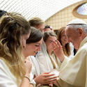 Pope Francis blesses a woman during his weekly audience in Paul VI hall at the Vatican Aug. 9 . (CNS photo/L'Osservatore Romano)